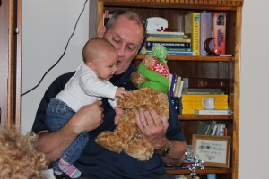 My dad giving Olivia her very first Christmas present.