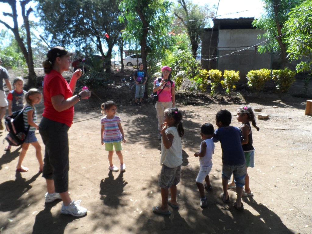 Blowing bubbles with Debbie and the Nica kids.