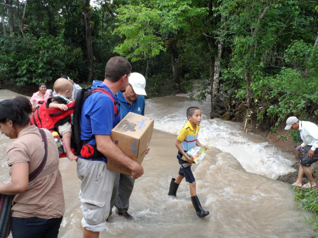 Crossing a river by foot in La Dalia to share the Gospel!