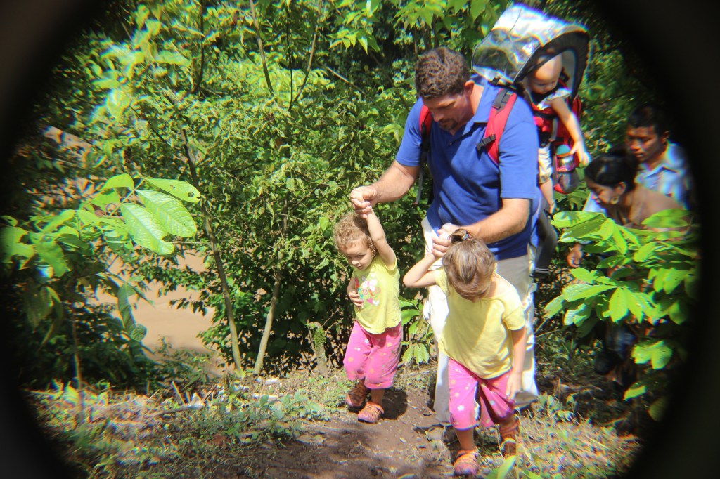 Phillip helping Emma & Paige walk in the mountains of Nicaragua.