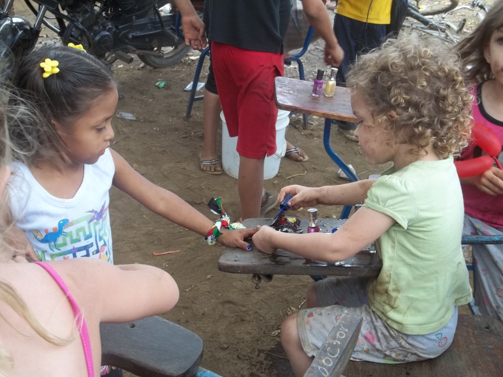 Paige painting nails during Med-Fest. 